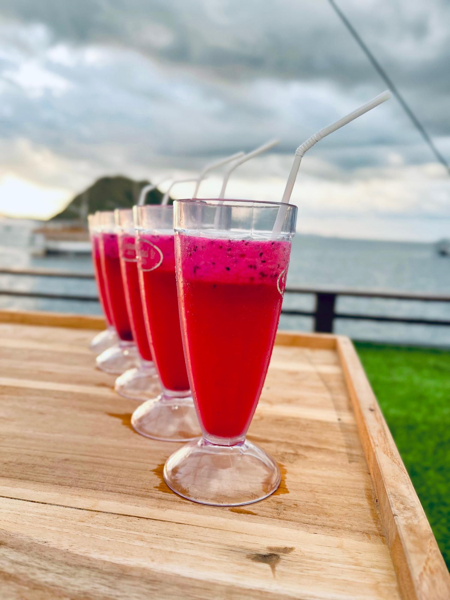 Glasses of red dragon fruit juice served on the sun deck