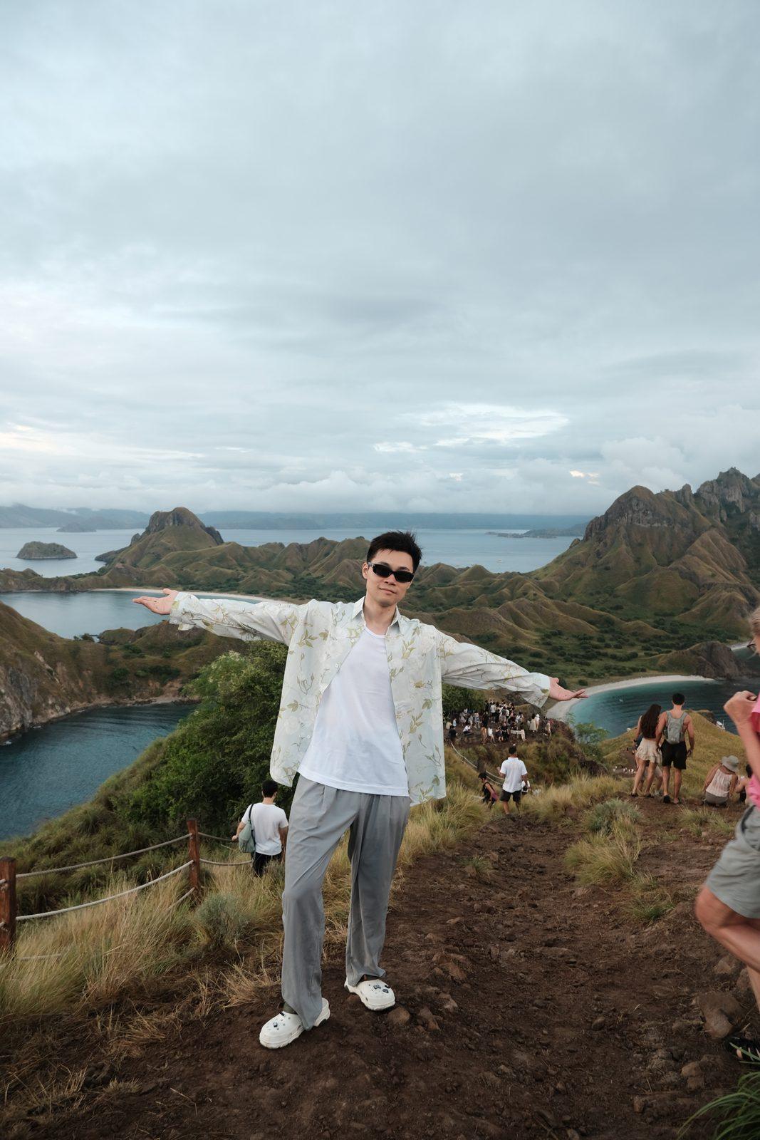 Padar – Man arms outstretched on Padar ridge (Taken on a real Komodo Explorer trip)
