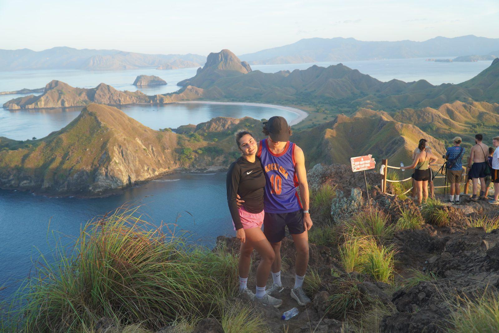 Padar – Couple at rail, bays, golden light (Taken on a real Komodo Explorer trip)