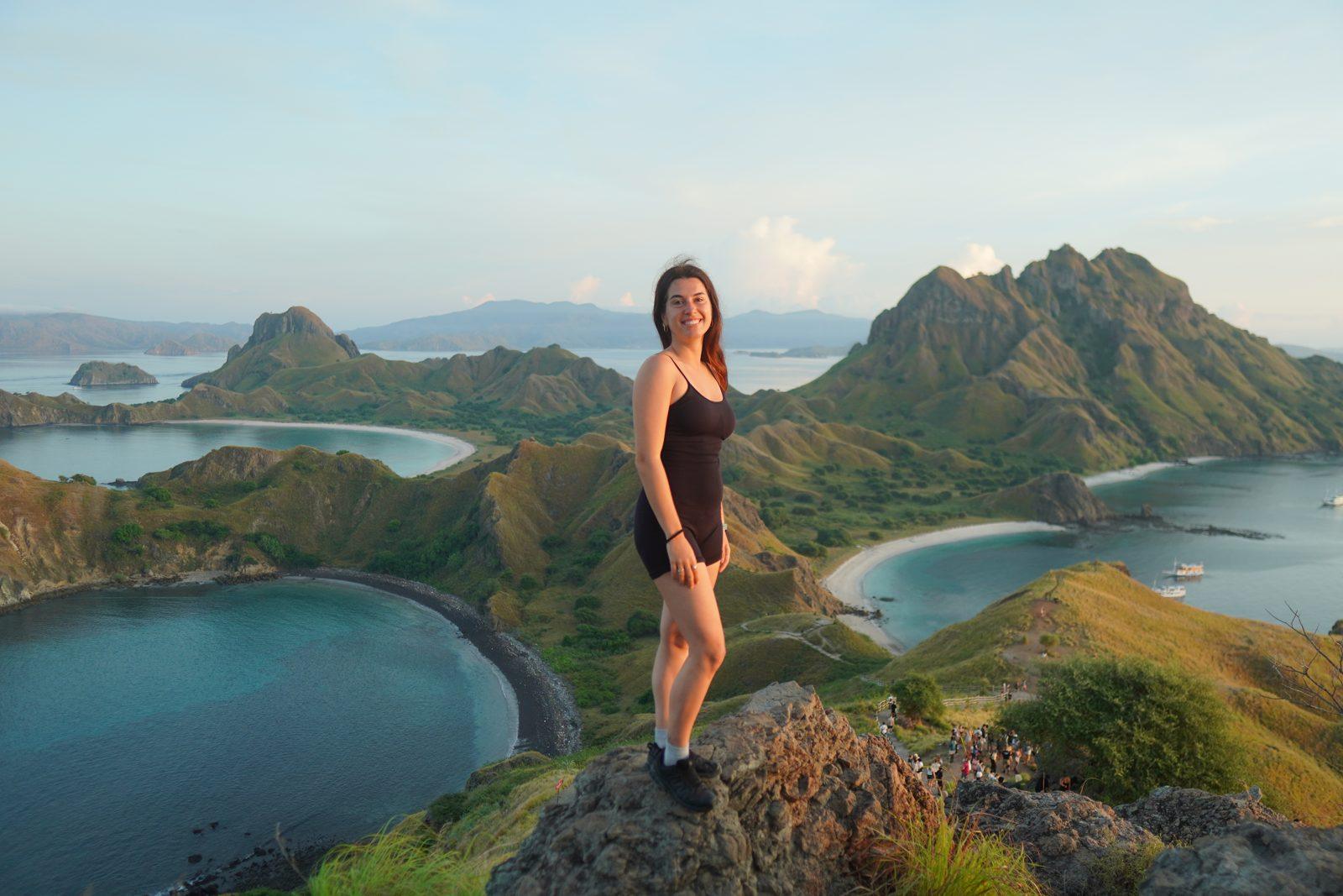 Padar – woman on ridge over three bays (Taken on a real Komodo Explorer trip)