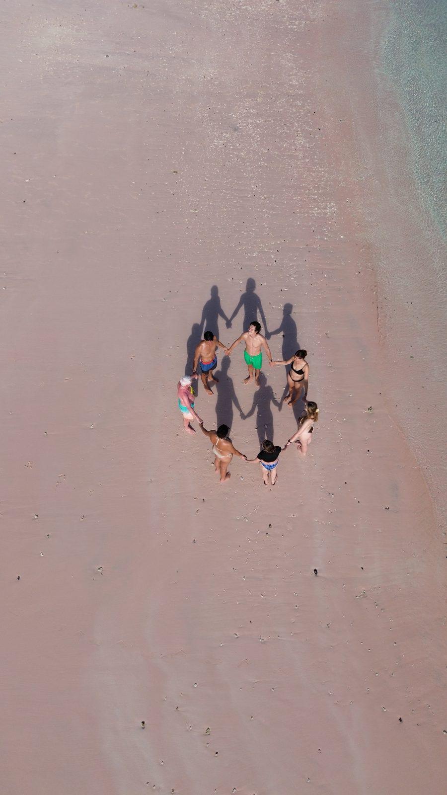 Pink Beach – Aerial group in circle on pink sand (Taken on a real Komodo Explorer trip)