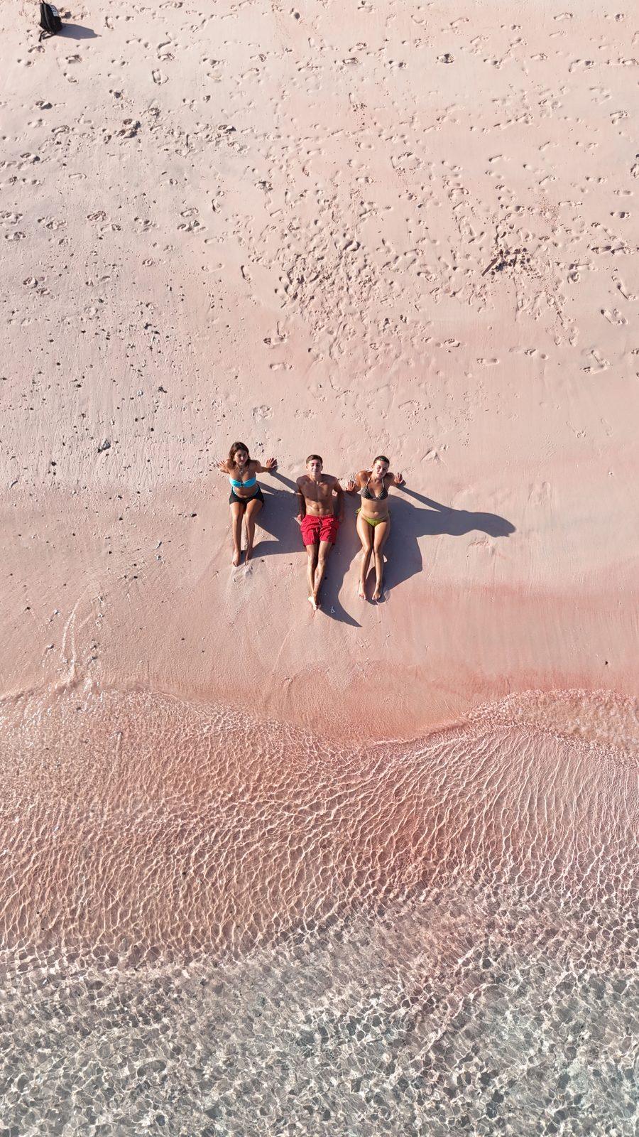 Pink Beach – four people on pink sand, drone (Taken on a real Komodo Explorer trip)
