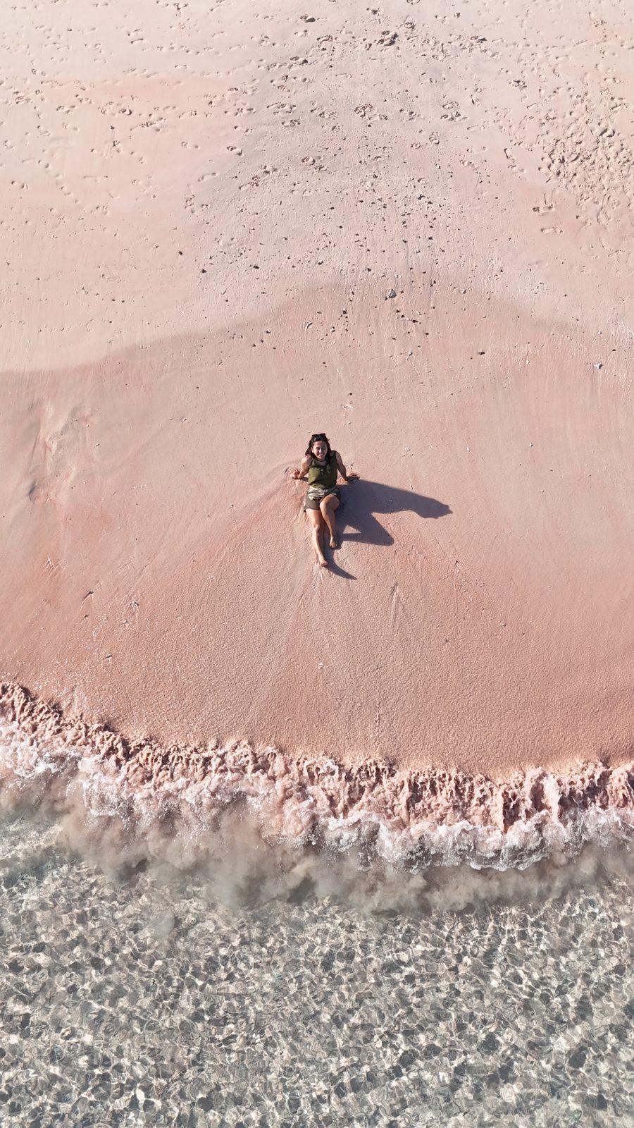Pink Beach – lone figure on pink sand, turquoise water (Taken on a real Komodo Explorer trip)