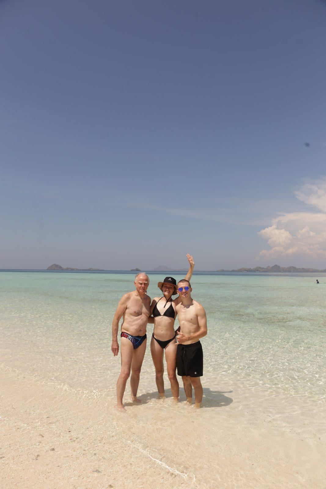 Taka Makassar – group on sandbar, arms raised (Taken on a real Komodo Explorer trip)