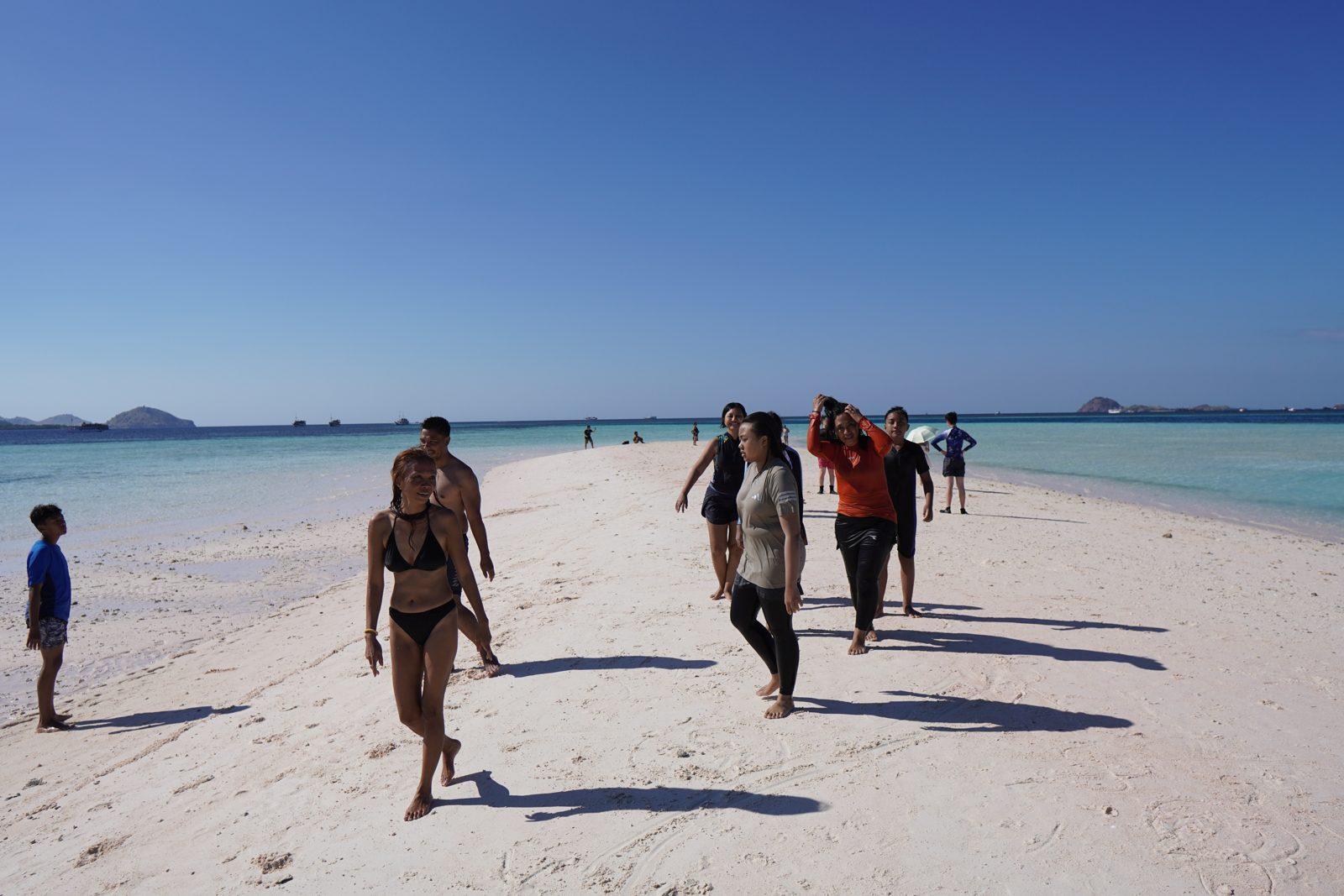 Taka Makassar – group walking on white sandbar (Taken on a real Komodo Explorer trip)