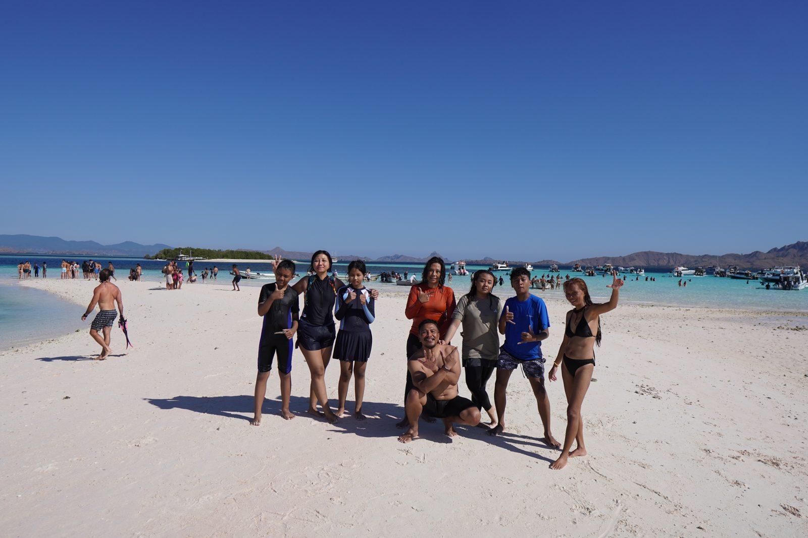 Taka Makassar – group posing on white sandbar (Taken on a real Komodo Explorer trip)