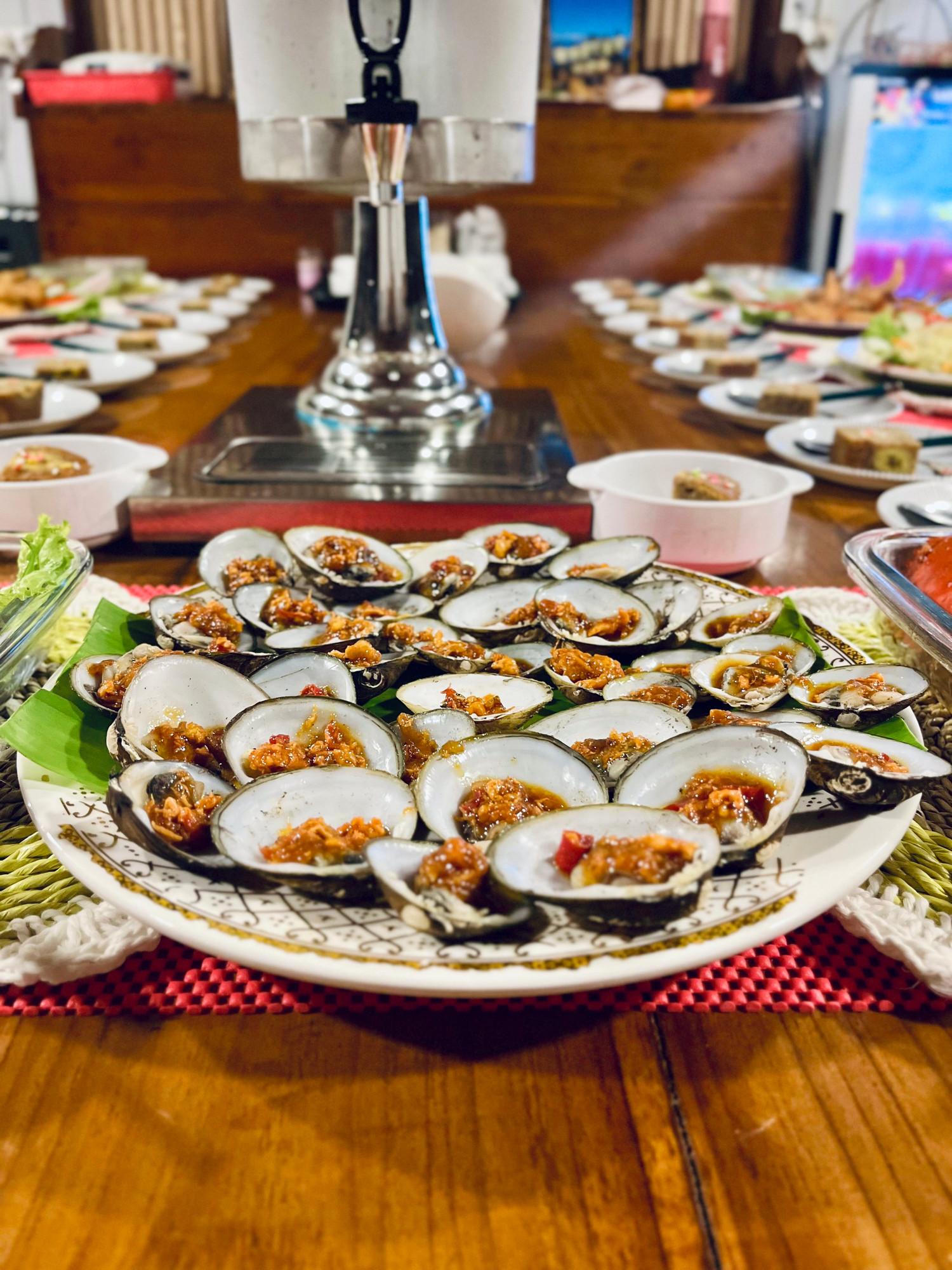 Clams on the half shell topped with chilli sambal
